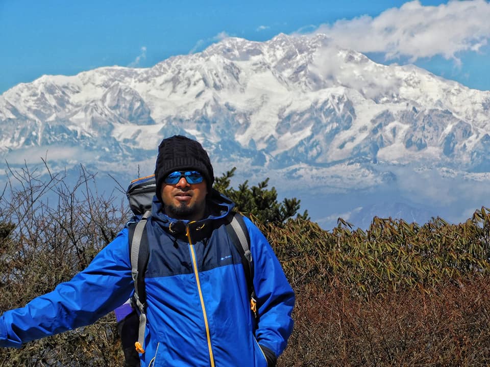 Just an Ordinary Trekker standing with Sleeping Buddha in the background during the Sandakphu Trek!