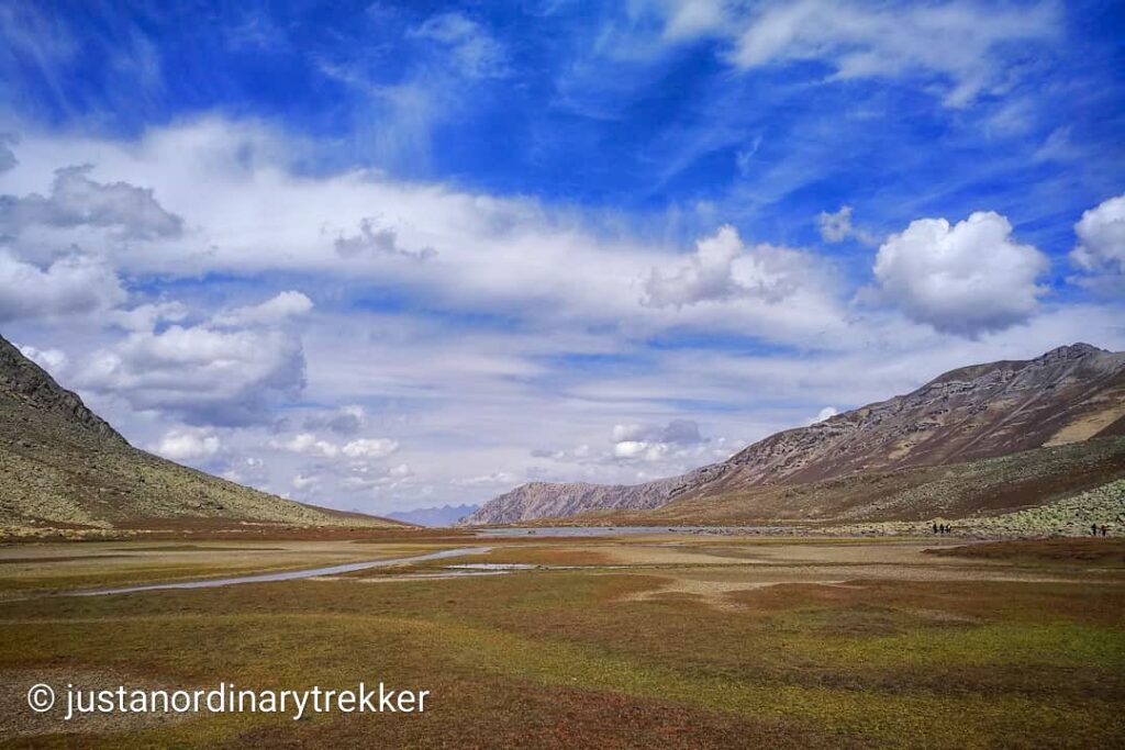 Scenic valley on the way to Satsar Camp during the Kashmir Great Lakes Trek, surrounded by mountains and alpine meadows.
