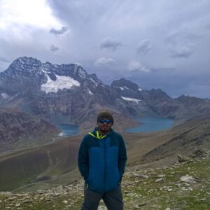 Trekker standing between Gangabal and Nundkol Lakes at Zajibal Pass during Kashmir Great lakes Trek