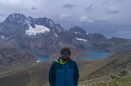 Trekker standing between Gangabal and Nundkol Lakes at Zajibal Pass during Kashmir Great lakes Trek