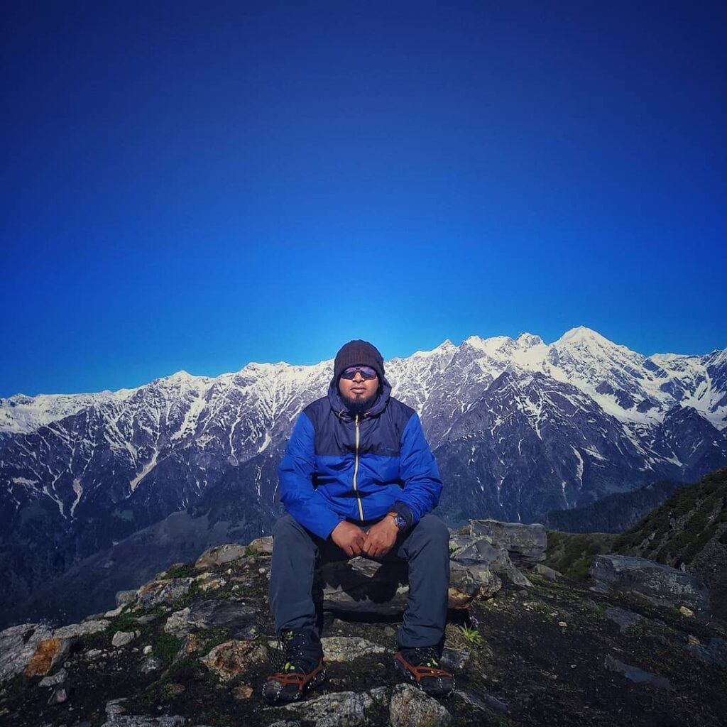 Me and snowclad mountains and gearing upto wearing the crampons!